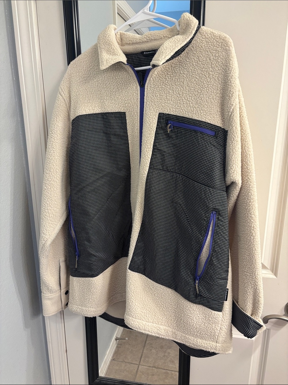 Cream Sherpa Zip Jacket with Black Contrast Panels and Blue Accents
